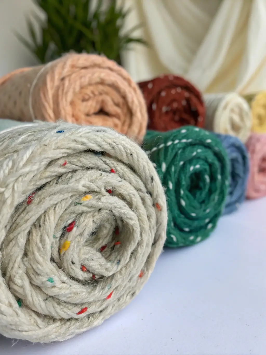 Image of recycled polyester fabric made from plastic bottles, showcasing the innovative material used in AREMEADOW's outerwear.
